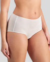 Model wears Au Naturel Full Brief in WHITE. On body front view
