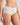 Model wears Au Naturel Full Brief in WHITE. On body front view