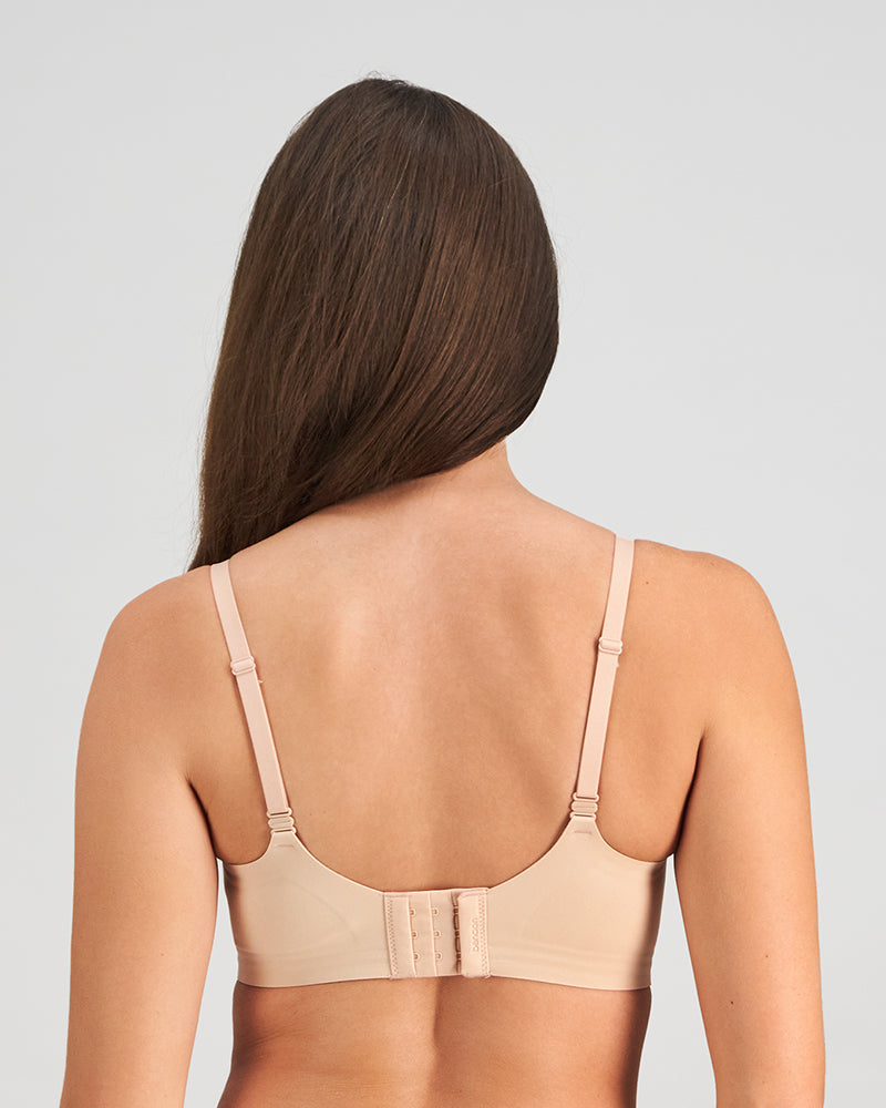 Model wears Comfit Collection Wire Free Front Opening Bra in LATTE. On body back view