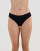 Model wears Stretch Cotton Bikini in BLACK. On body front view