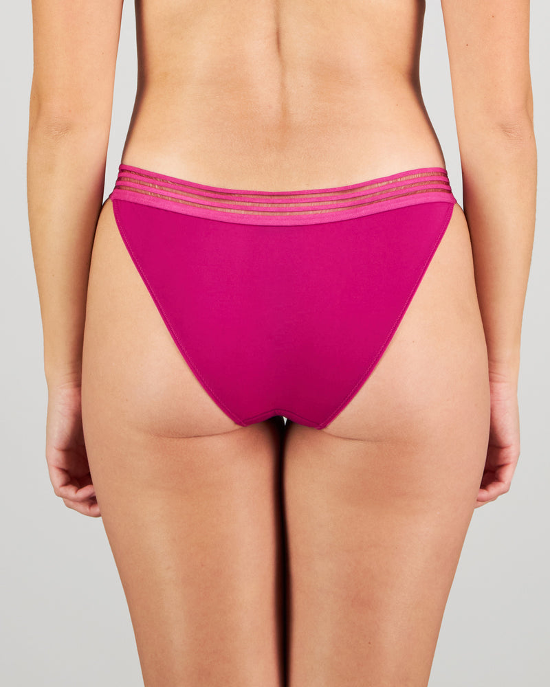 Model wears Stripe Elastic & Papertouch Tanga in FANTASY FUCHSIA. On body back view