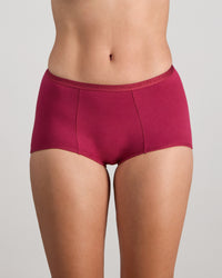 Model wears Body Cotton Full Brief in BEAUJOLAIS. On body front view