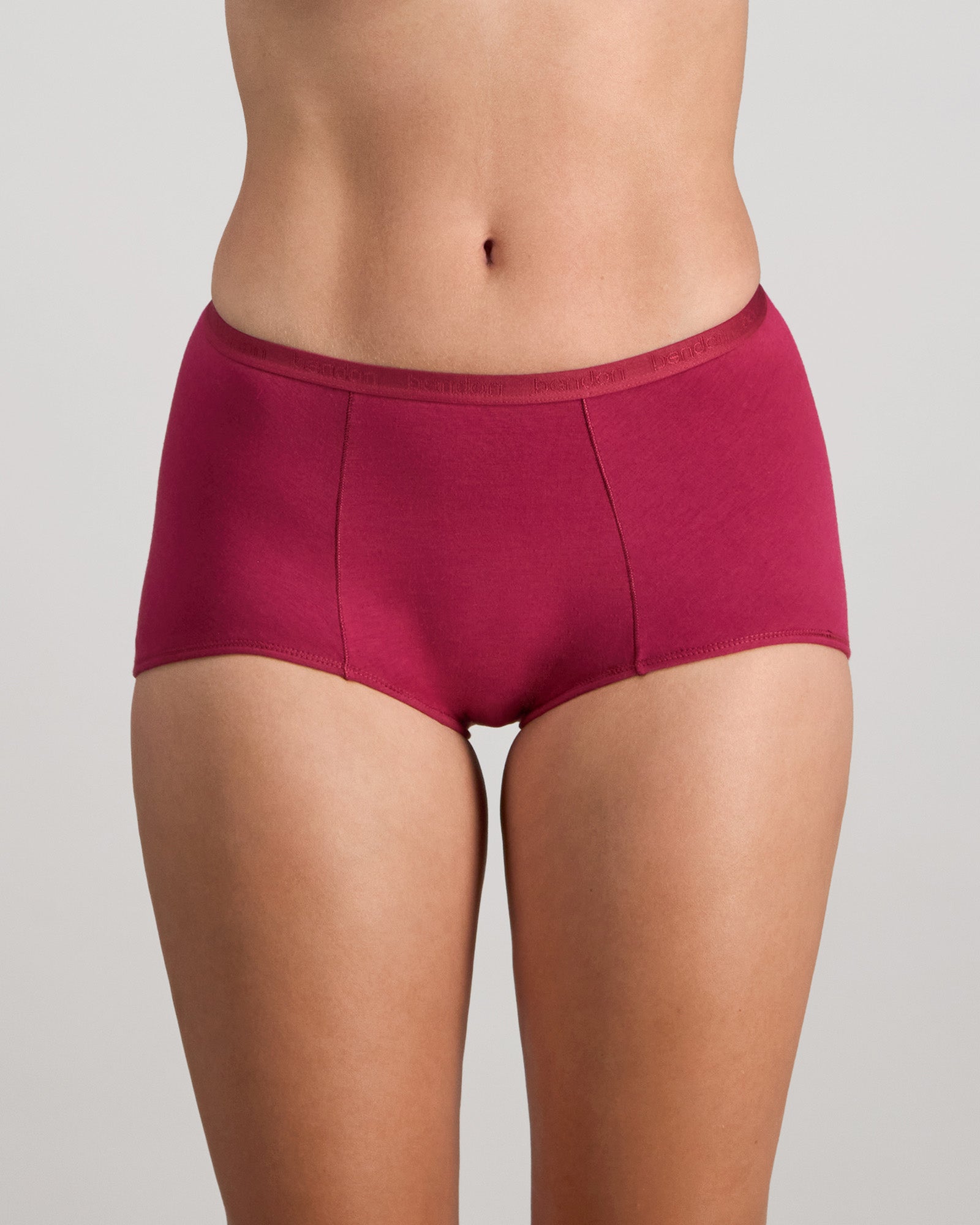 Model wears Body Cotton Full Brief in BEAUJOLAIS. On body front view