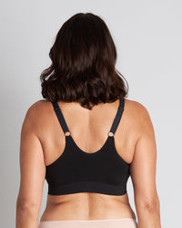 Model wears Bendon Restore Wire Free Front Opening Bra in BLACK. On body back view