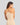Model wears Simply Seamless Camisole in Nude. On body back view