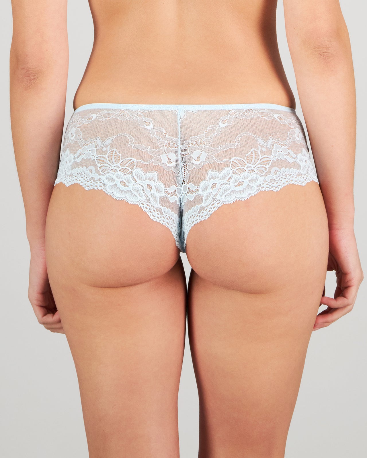 Model wears My Fit Lace Brazilian in OMPHALODES. On body back view