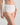Model wears Freedom Full Brief in WHITE. On body side view