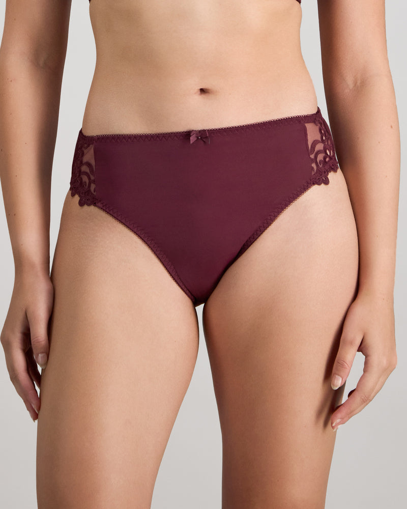 Model wears Coral High Cut Brief in FIG. On body front view