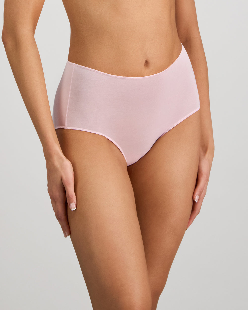 Model wears Au Naturel Full Brief in PALE LILAC. On body side view