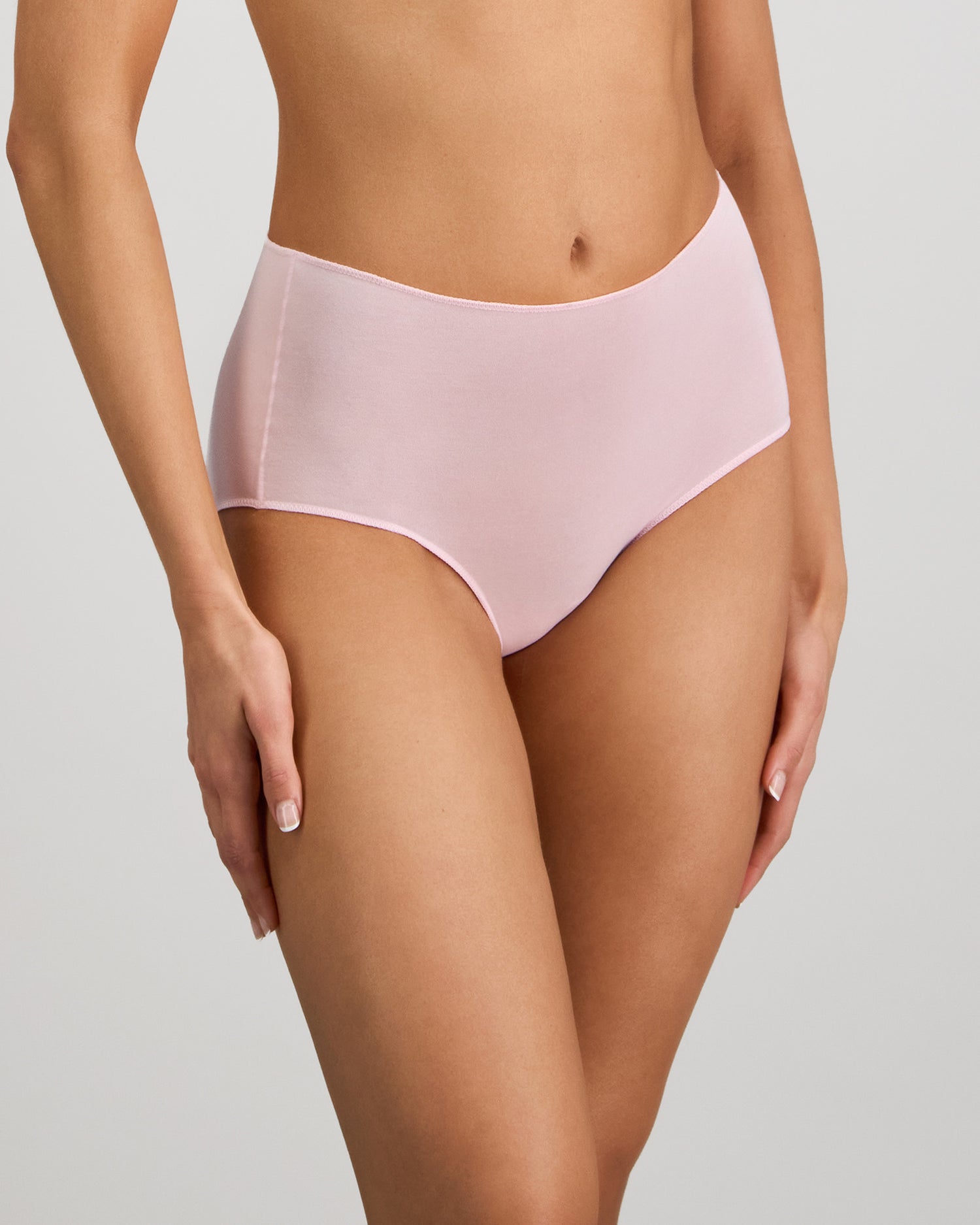 Model wears Au Naturel Full Brief in PALE LILAC. On body side view