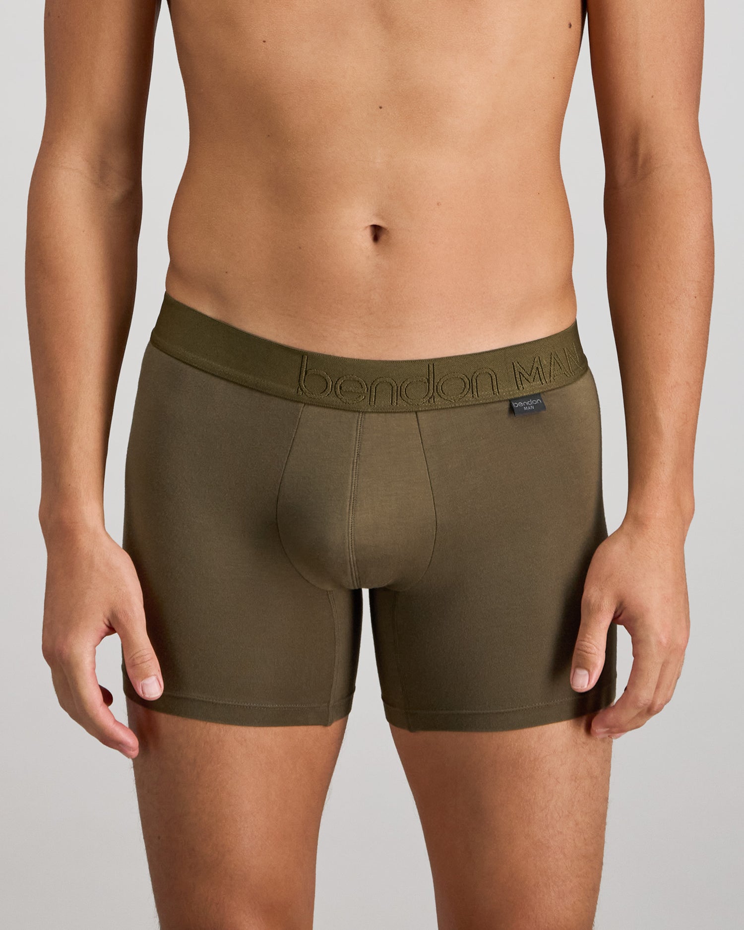 Model wears Bamboo Mens Trunk in DARK OLIVE. On body front view
