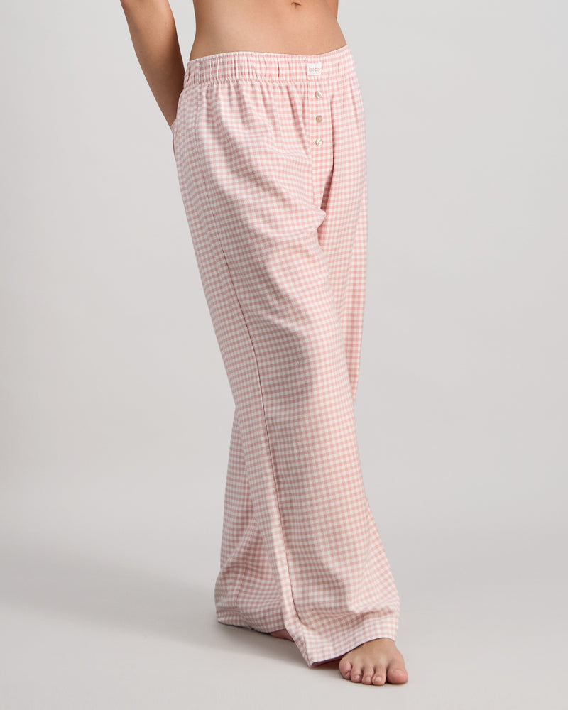 Model wears Cosy Flannel Long PJ Pant in ROSE MINI GINGHAM. On body side view