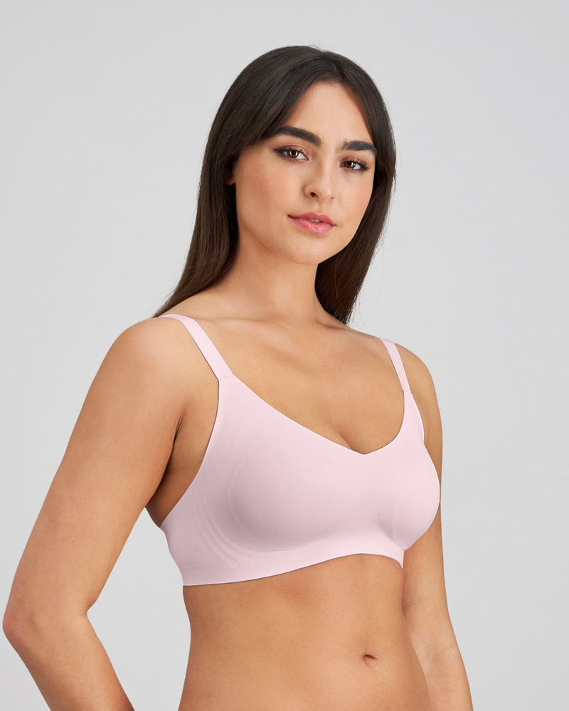 Model wears Comfit Collection Wire Free Bra in FESTIVAL BLOOM. On body front view