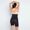 Model wears Medium Control High Waisted Shaper Short in BLACK. On body back view