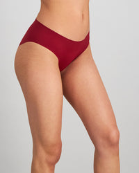 Model wears No Show Bikini in BIKING RED. On body side view
