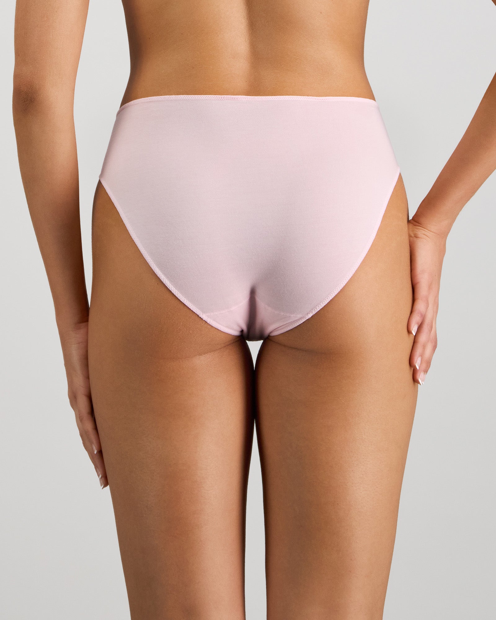 Model wears Au Naturel High Cut Brief in PALE LILAC. On body back view