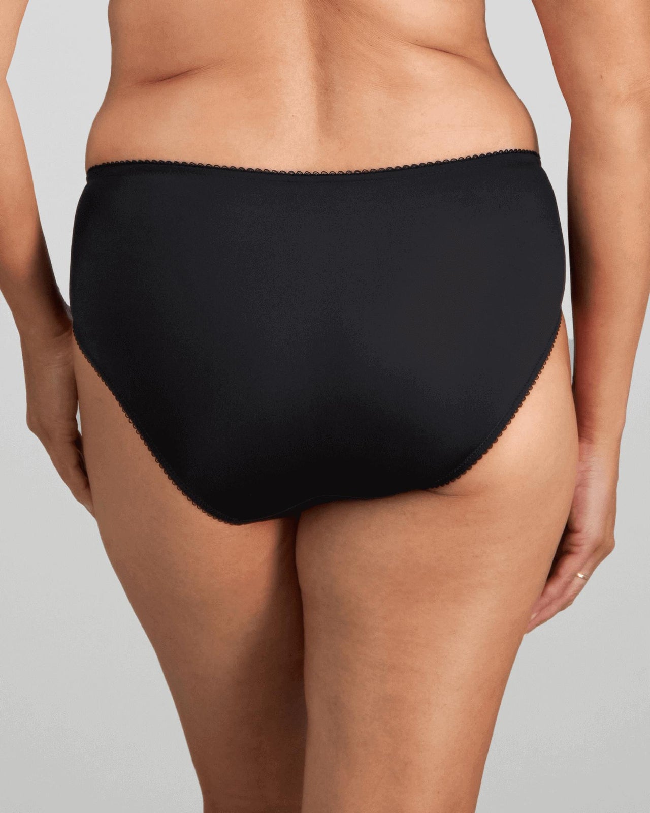 Model wears Mesmerise Midi in BLACK. On body back view