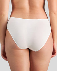 Model wears Au Naturel High Cut Brief in WHITE. On body back view