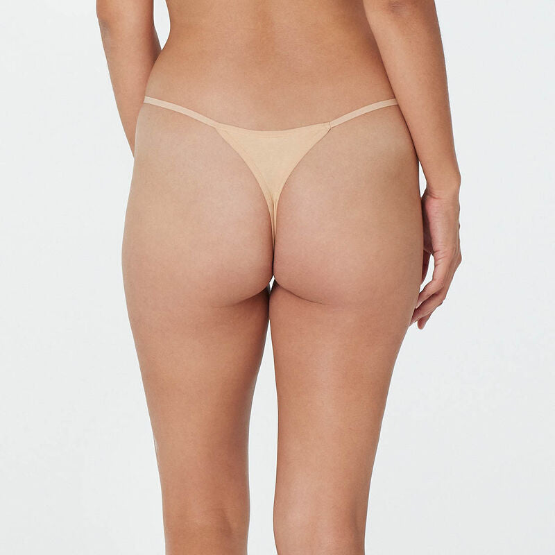 Model wears Clemence Thong in AMERICAN NUDE. On body back view