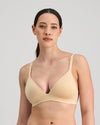Model wears Simply Seamless Wire Free Bra in Nude. On body front view