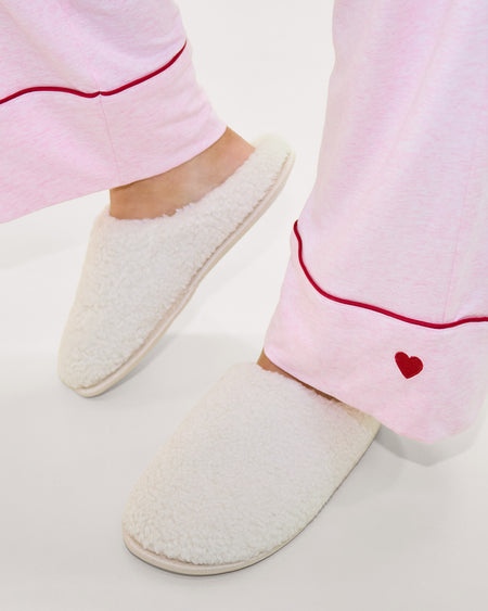 Model wears Teddy Slippers in CREAM. On body front view