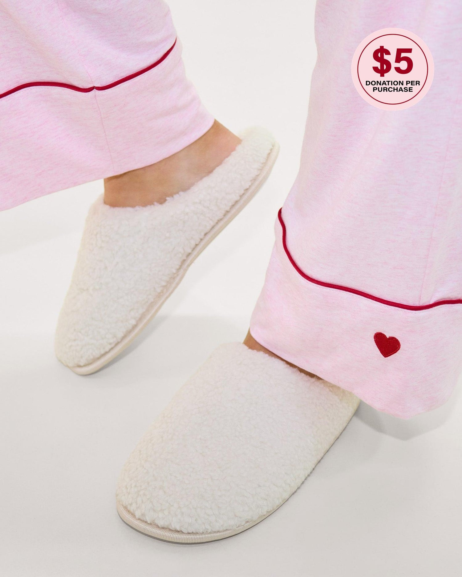 Model wears Teddy Slippers in CREAM. On body front view