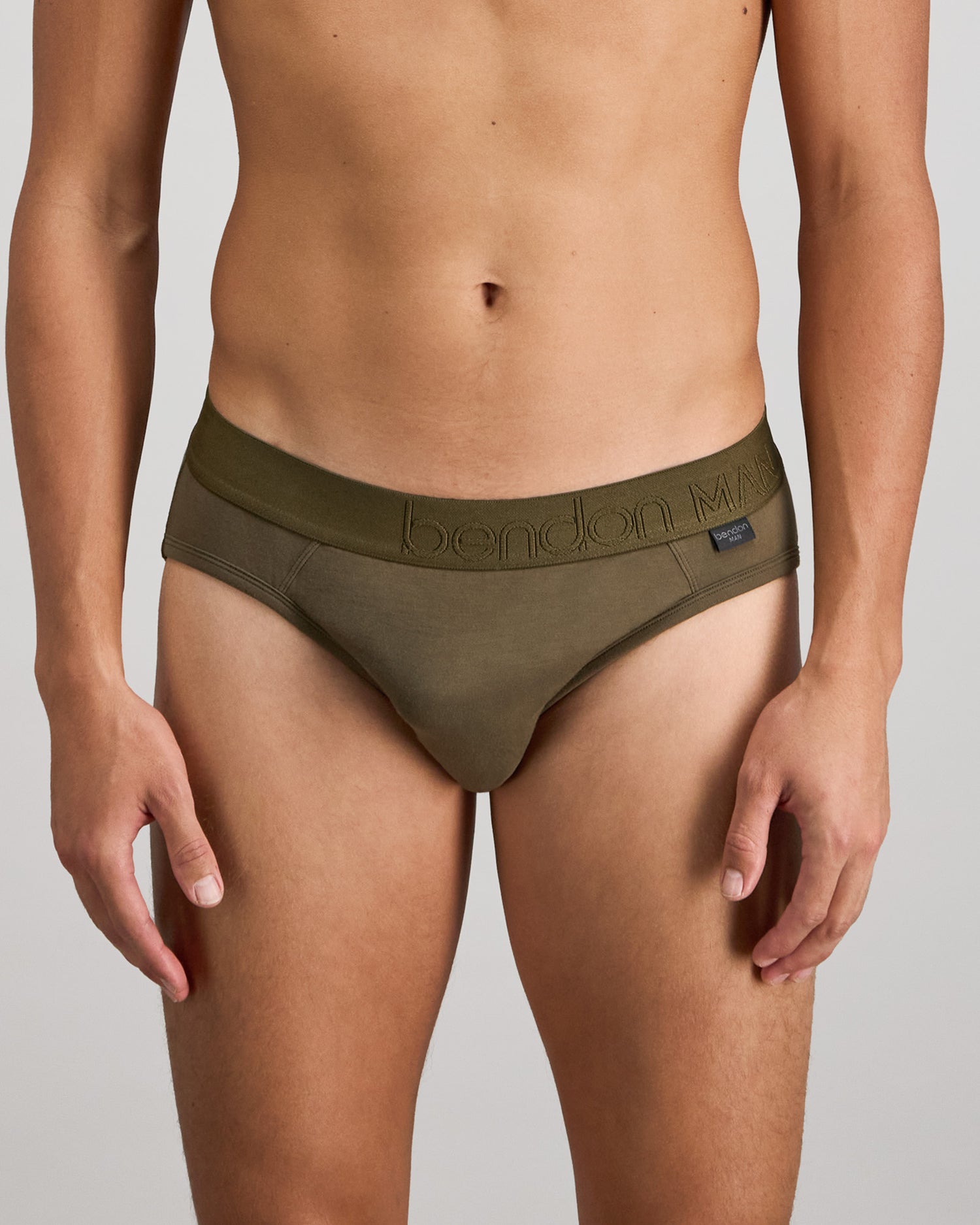 Model wears Bamboo Mens Brief in DARK OLIVE. On body front view