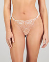 Model wears Eros Thong in SUGAR. On body front view