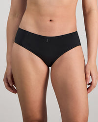 Model wears My Fit Smooth Brazilian in BLACK. On body front view