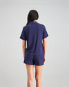 Model wears Belle Bamboo Short PJ in EVENING BLUE. On body back view