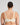 Model wears Delicate Lace Underwire Bra in IVORY/CREAM TAN. On body back view