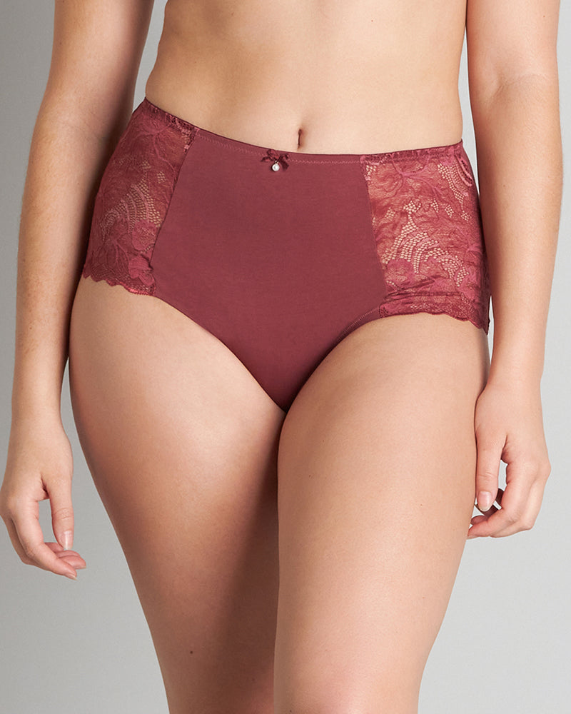 Model wears Embrace Full Brief in OXBLOOD RED. On body front view
