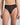 Model wears Sheer Essence Thong in BLACK. On body front view