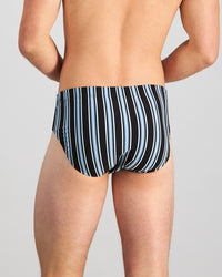 Model wears Cotton Stretch Mens Brief in AQUIFER/BLACK STRIPE. On body back view