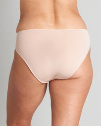 Model wears Au Naturel High Cut Brief in LATTE. On body back view