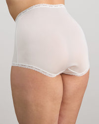 Model wears Nylon Tricot Full Brief in WHITE. On body side view