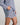 Model wears Cabana Stripe Short Pj in COOL BLUE. On body side view