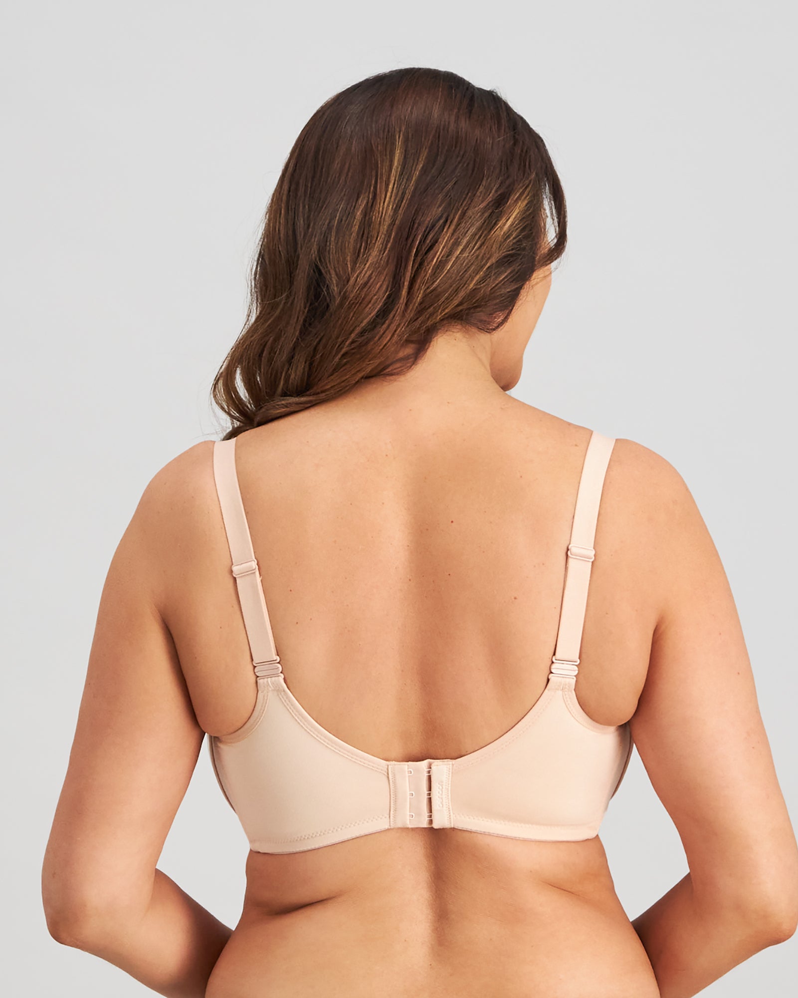 Model wears Bendon Restore Mastectomy Bra in LATTE. On body back view