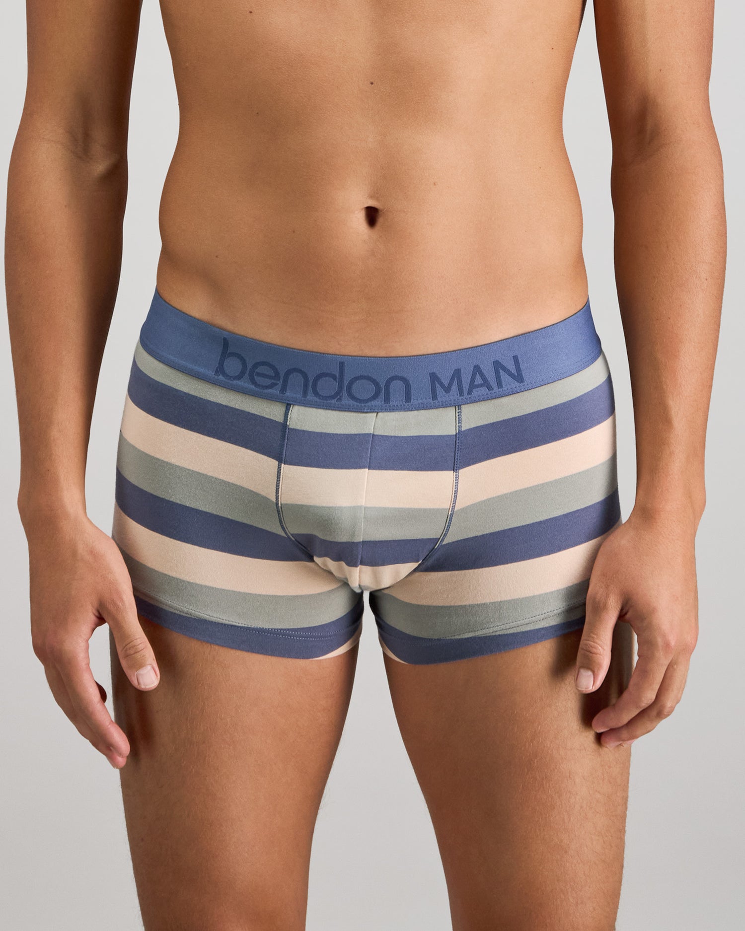 Model wears Rugby Stripe Mens Trunk in INDIGO/ICEBERG/SMOKE. On body front view