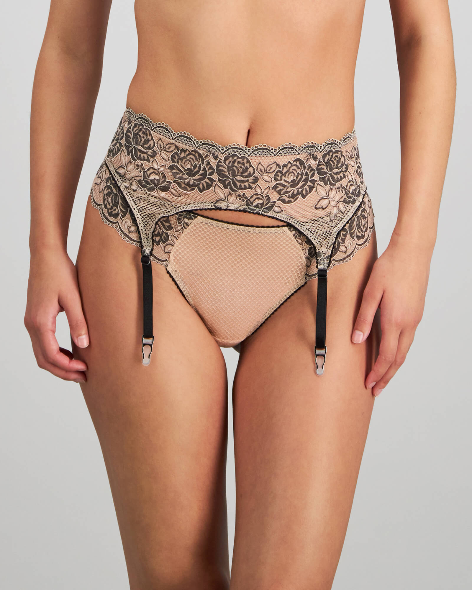 Model wears Everlasting Love Suspender in CAMEO ROSE / BLACK. On body front view