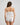 Model wears Body Cocoon Boyshort in WHITE. On body back view