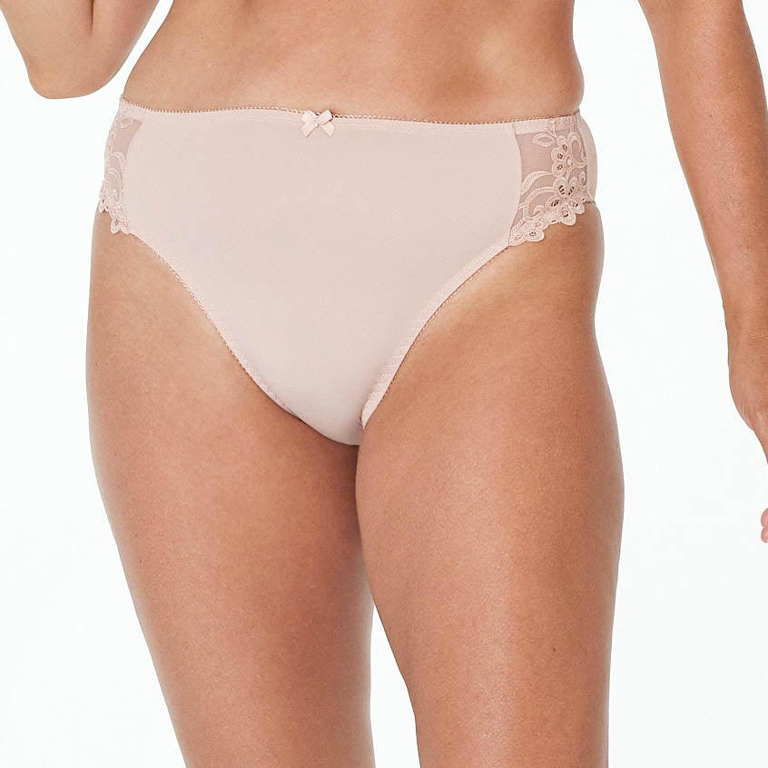 Model wears Coral High Cut Brief in LATTE. On body front view