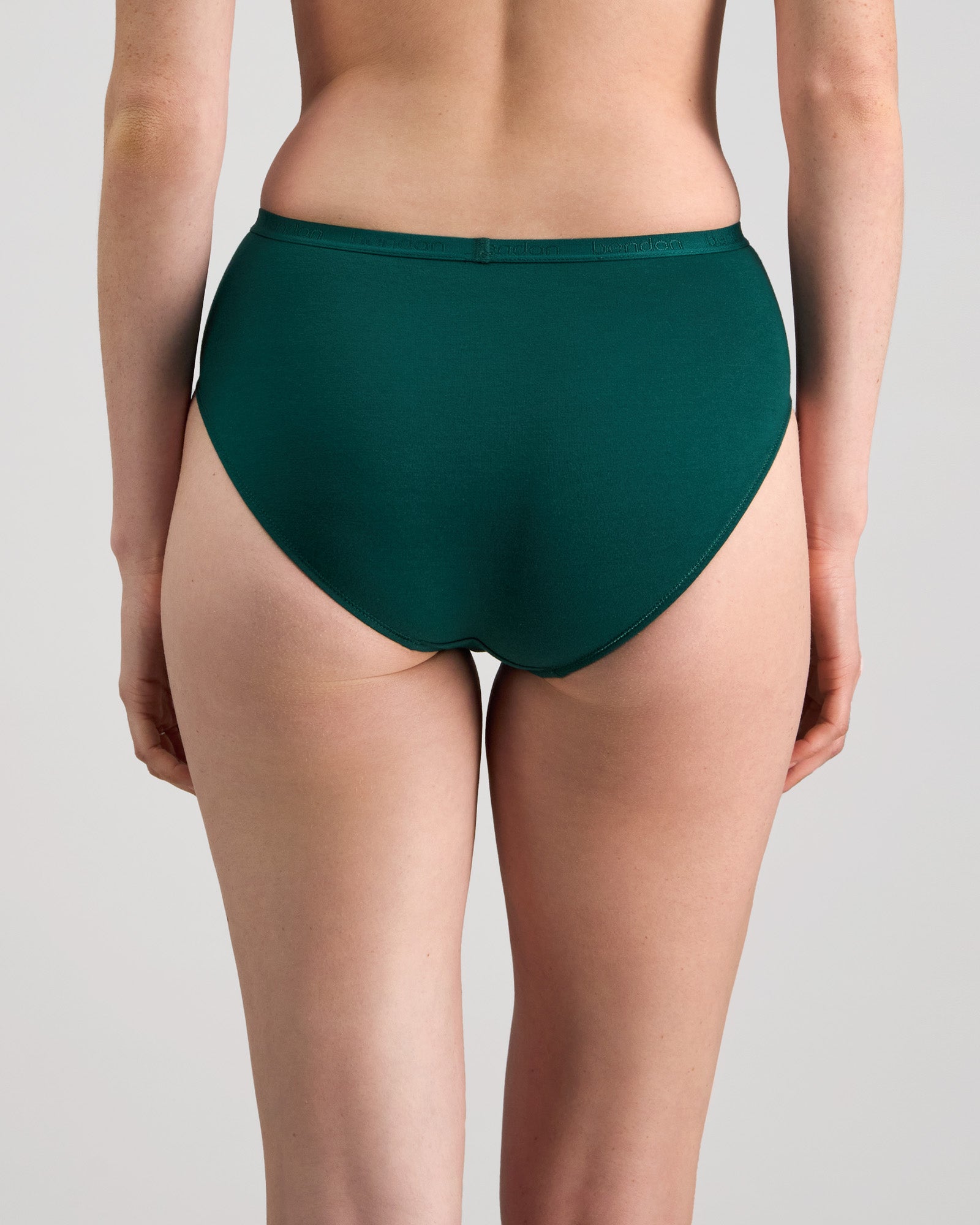 Model wears Body Cotton High Cut Brief in RAIN FOREST. On body back view