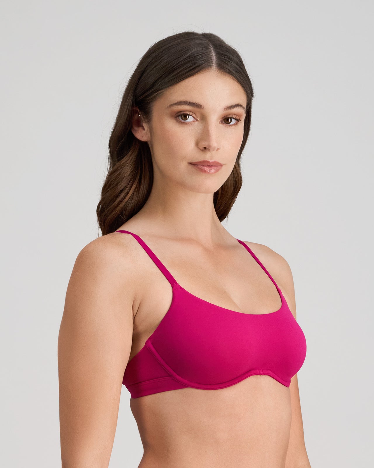 Model wears Extra-Ordinary Contour Bra in FANTASY FUCHSIA. On body side view