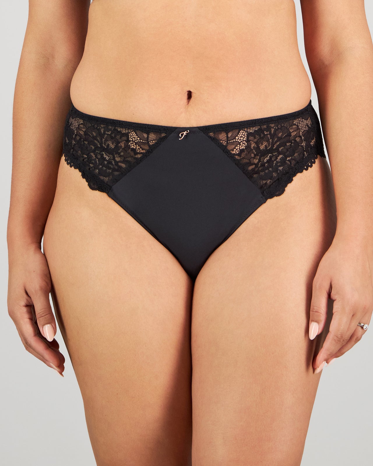 Model wears Laurel High Cut Brief in BLACK. On body front view