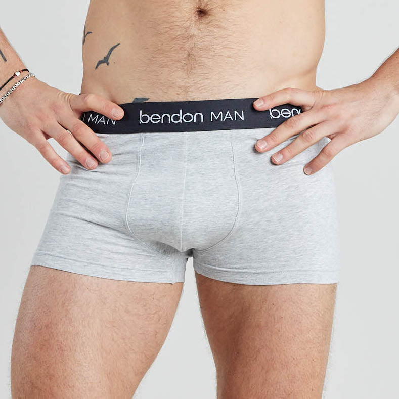 Model wears Organic Cotton Mens Trunk in LIGHT GREY MARL. On body front view