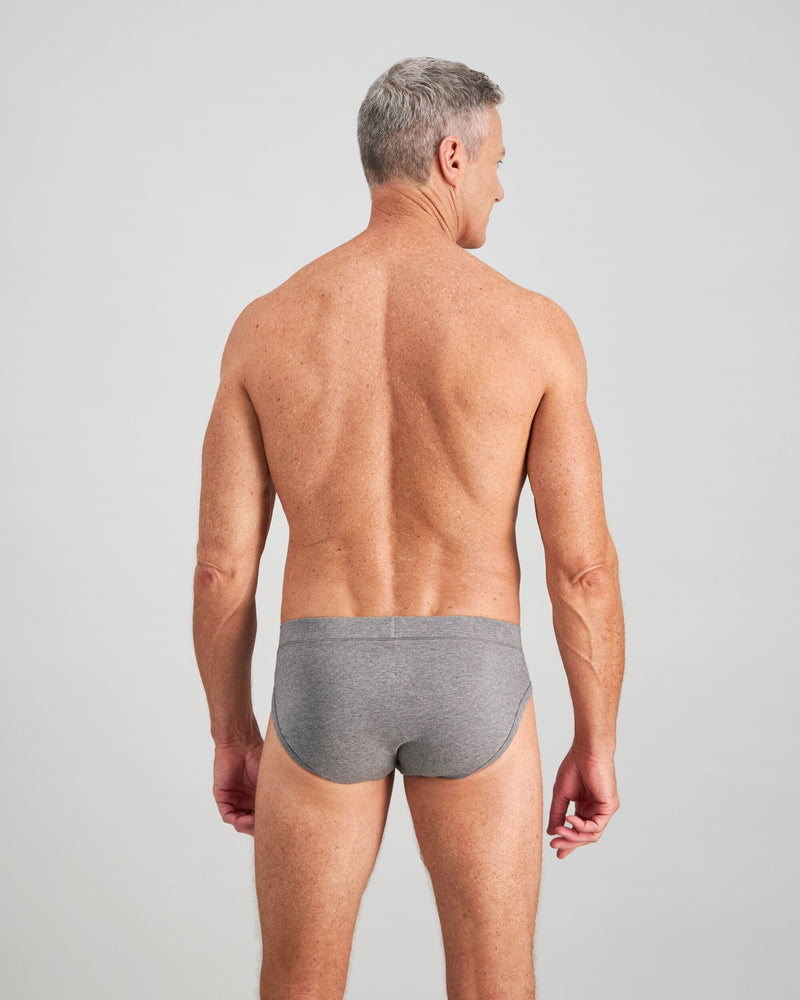 Model wears High Tech Cotton Mens Brief in GREY MARL. On body back view