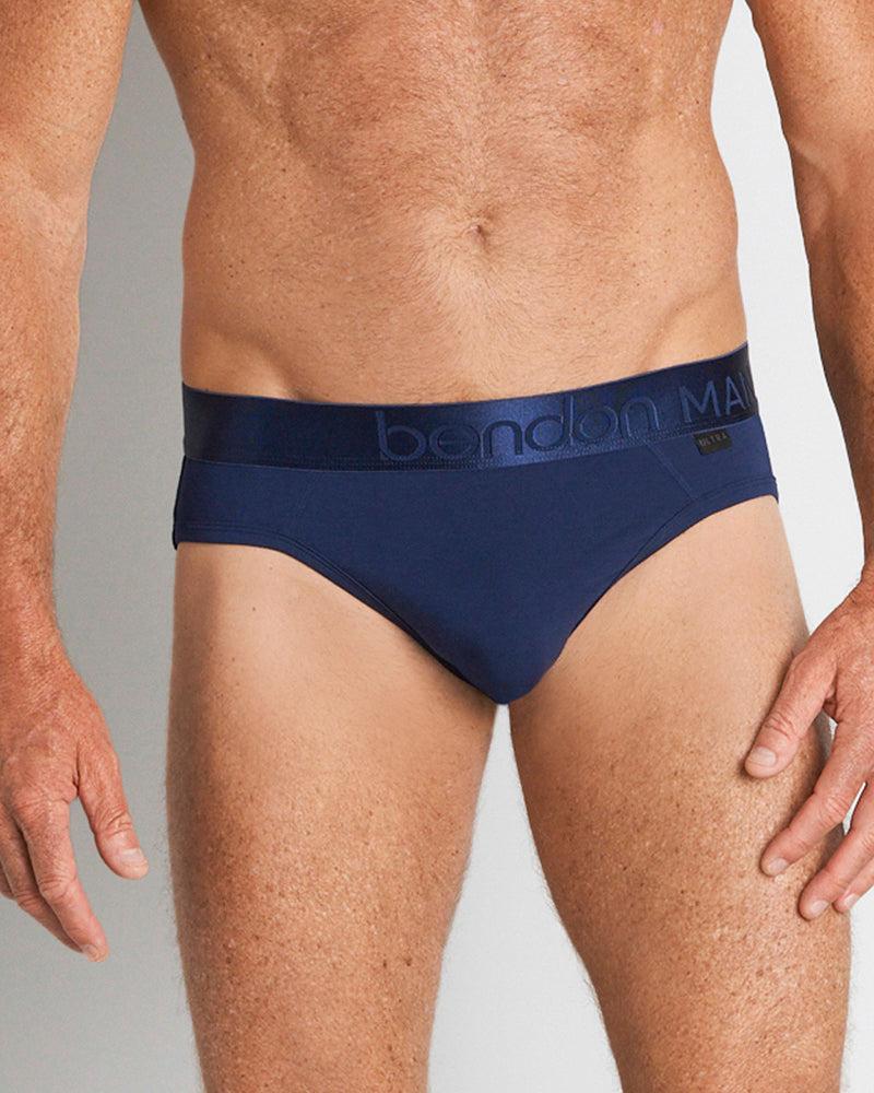 Model wears Bamboo Mens Brief in Medieval Blue. On body front view