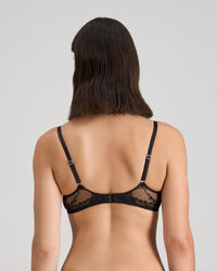 Model wears Niara Underwire Bra in BLACK/BEAUJOLAIS. On body back view