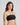 Model wears Extra-Ordinary Bandeau in BLACK. On body side view
